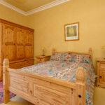 Bedroom with pine furniture.