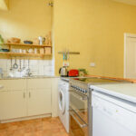 Oven, cabinets, open shelving.