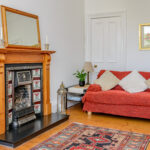 Living room, fireplace, couch.