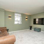 Living room with modern decor and TV setup