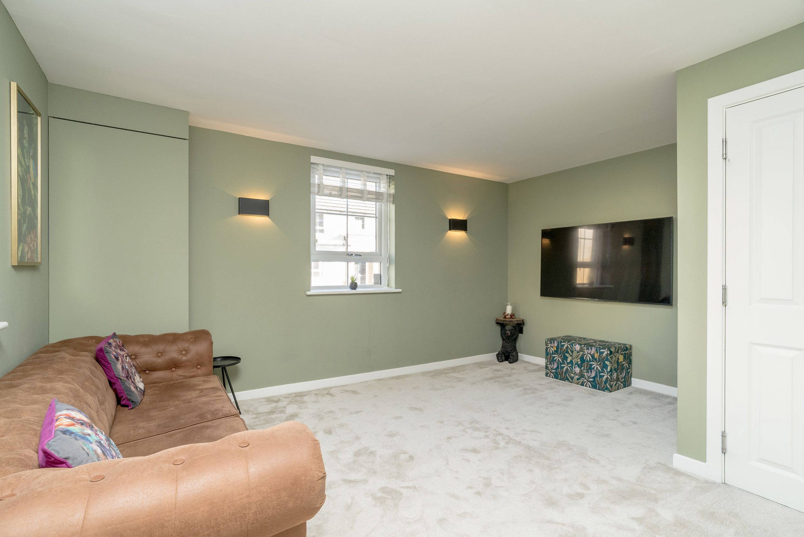 Living room with modern decor and TV setup