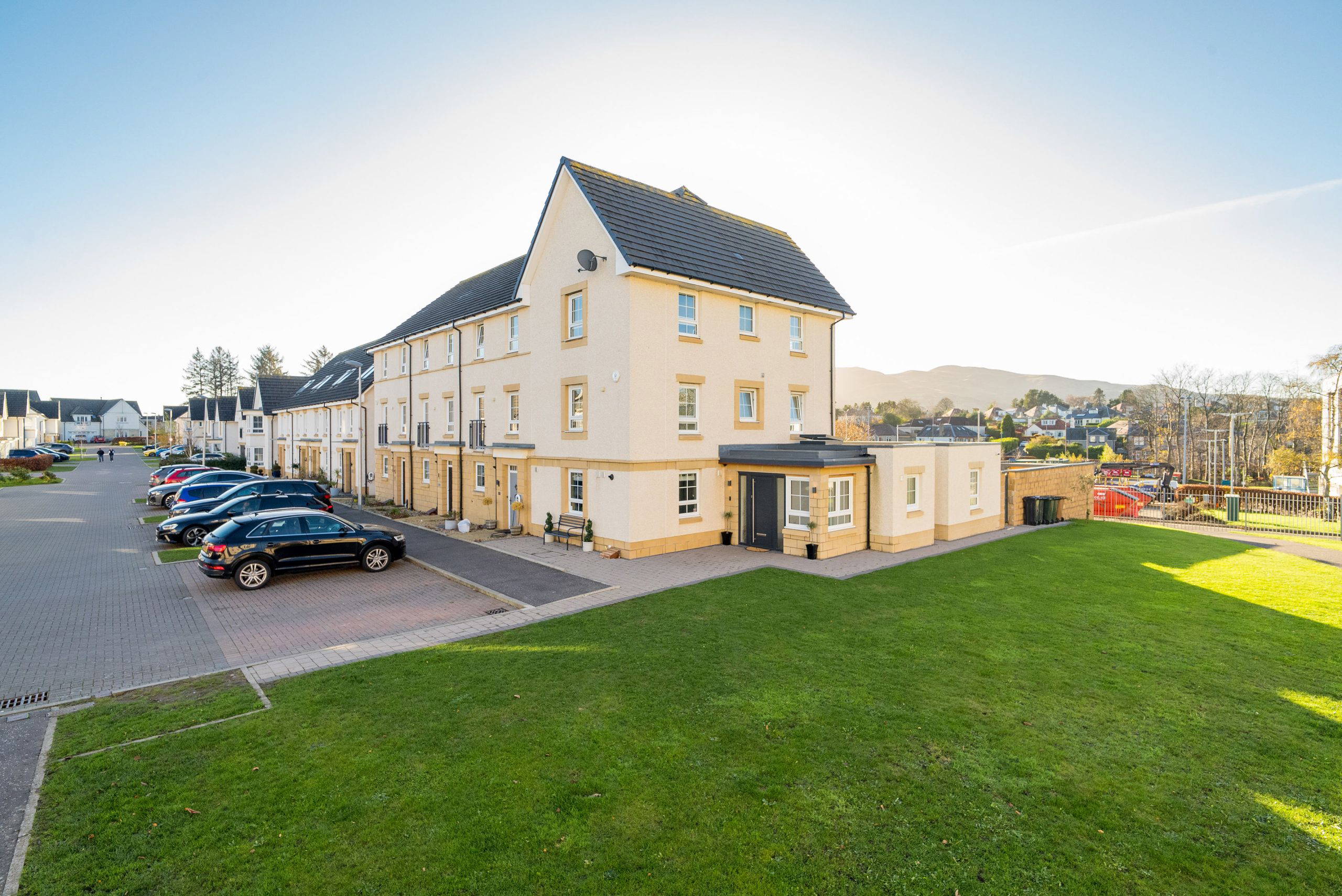 Exterior view of a residential building with parking