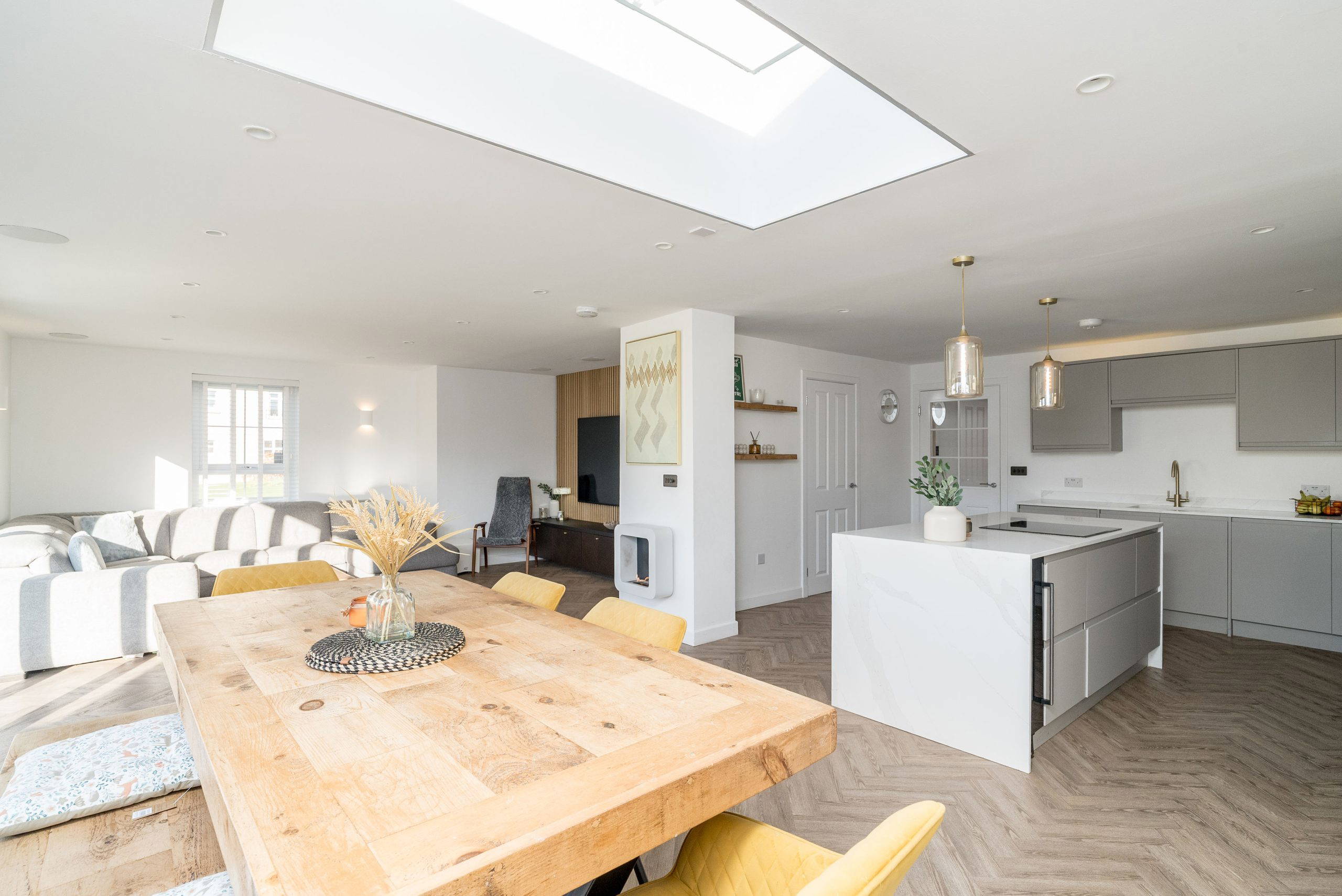 Open-plan living and kitchen area with modern decor