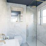Modern shower room with marble tiles