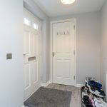 Entrance hallway with door and coat hooks